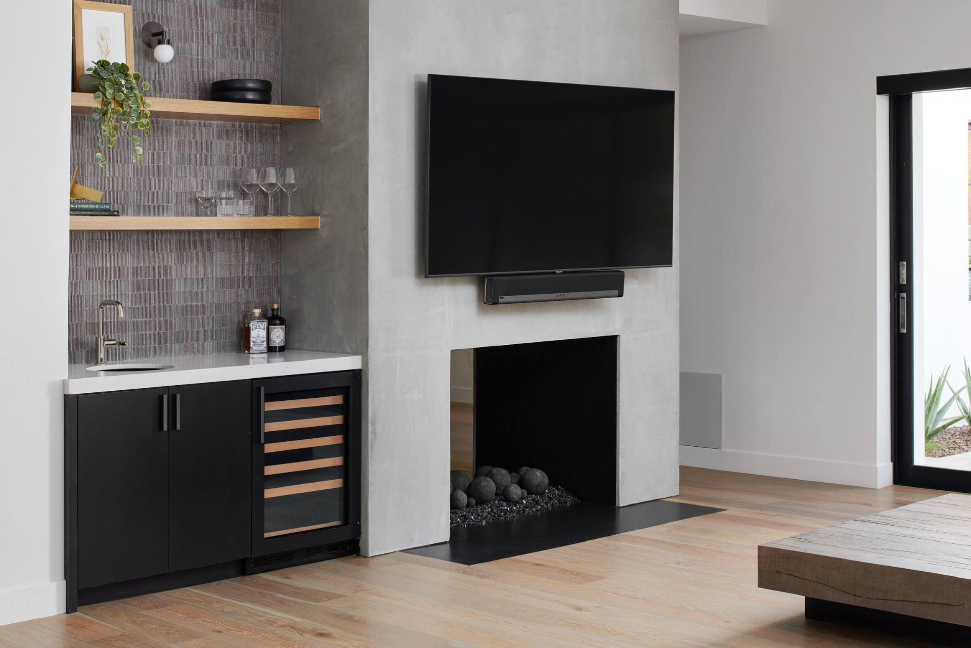 Media wall with fireplace and wet bar