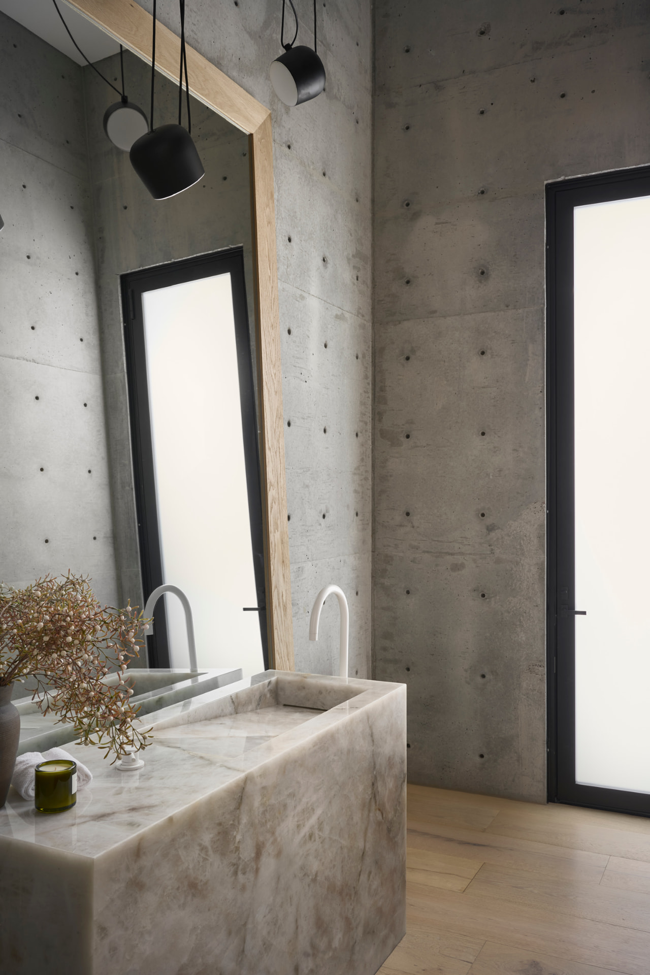 Pool bath with stone vanity and concrete walls