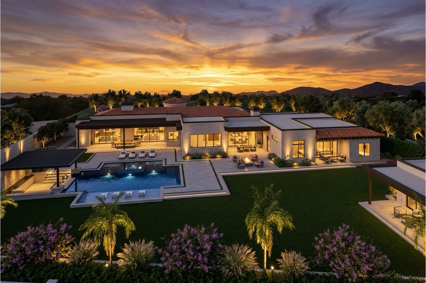 Rear elevation with pool and lawn at sunset