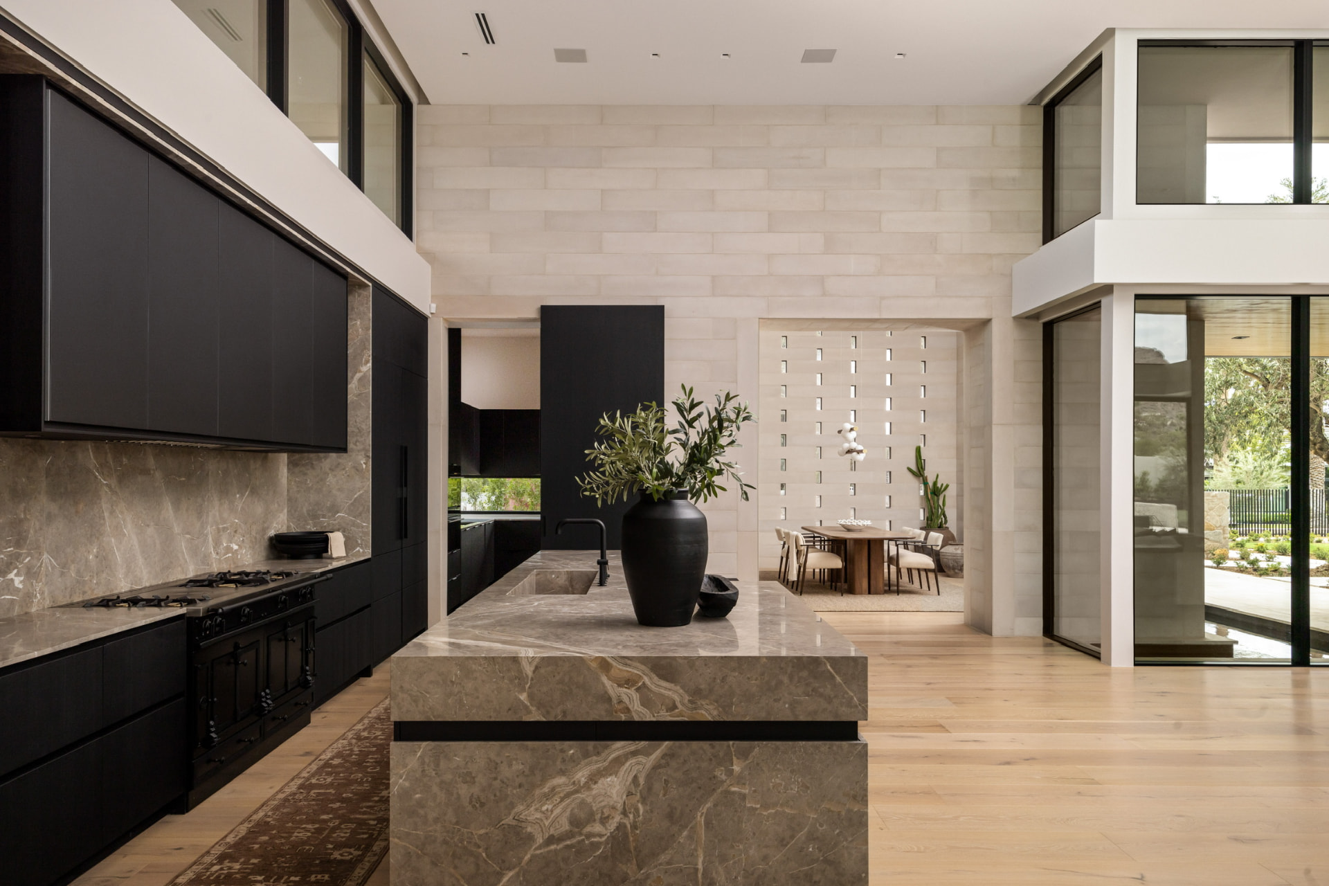 Kitchen with marble island and black range