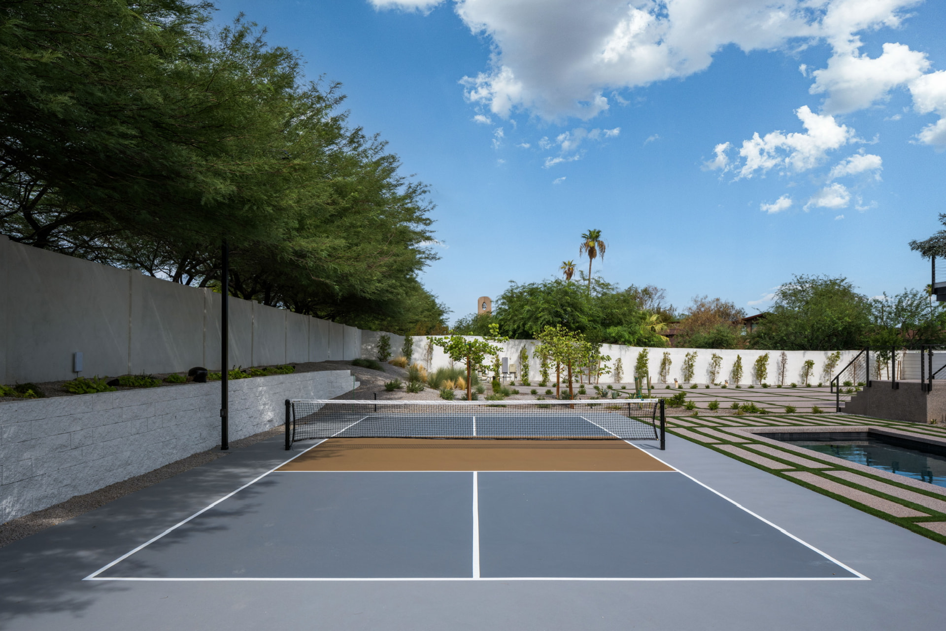 Sports court surrounded by desert landscaping