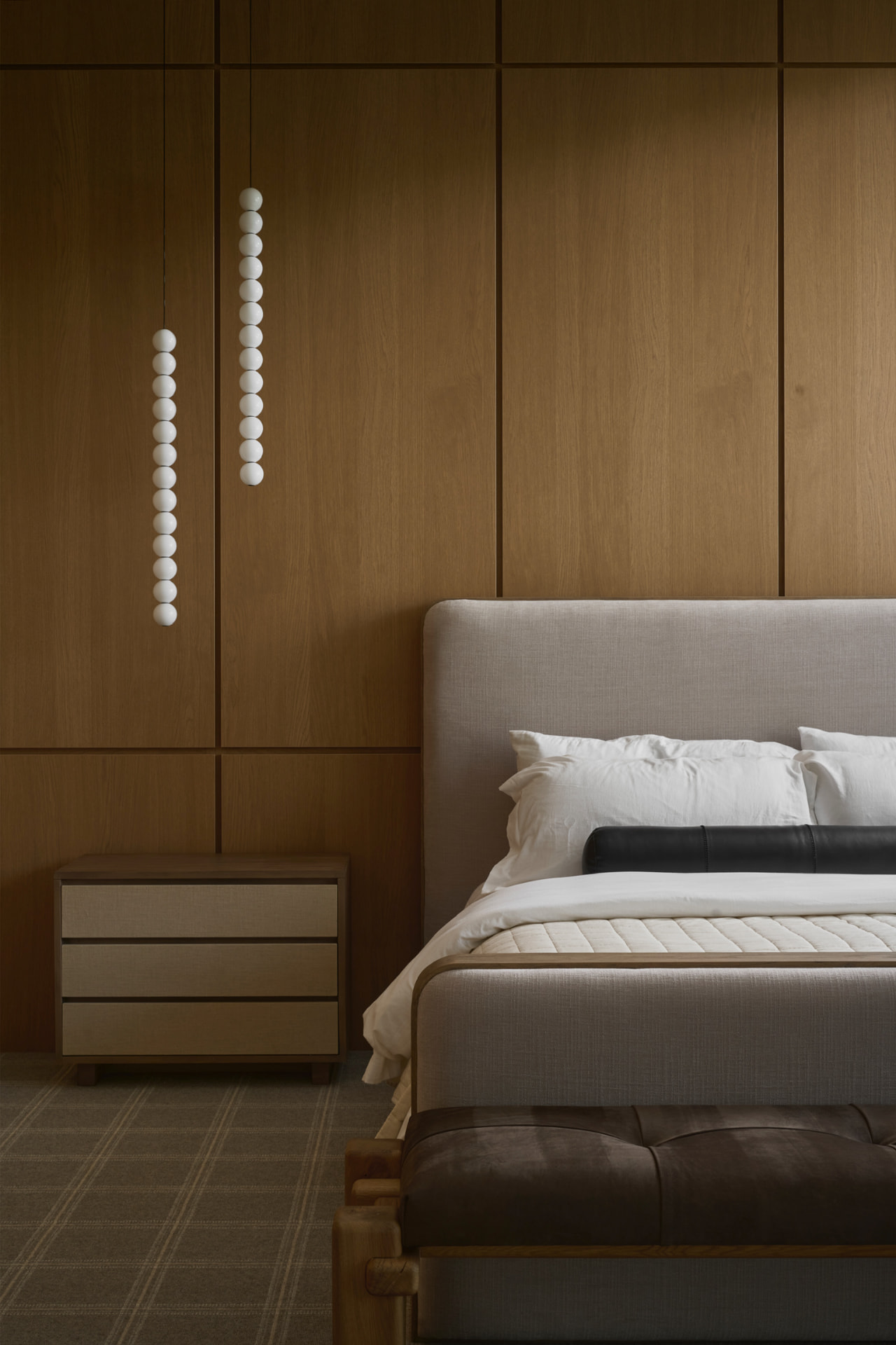 Primary bedroom with wood paneling