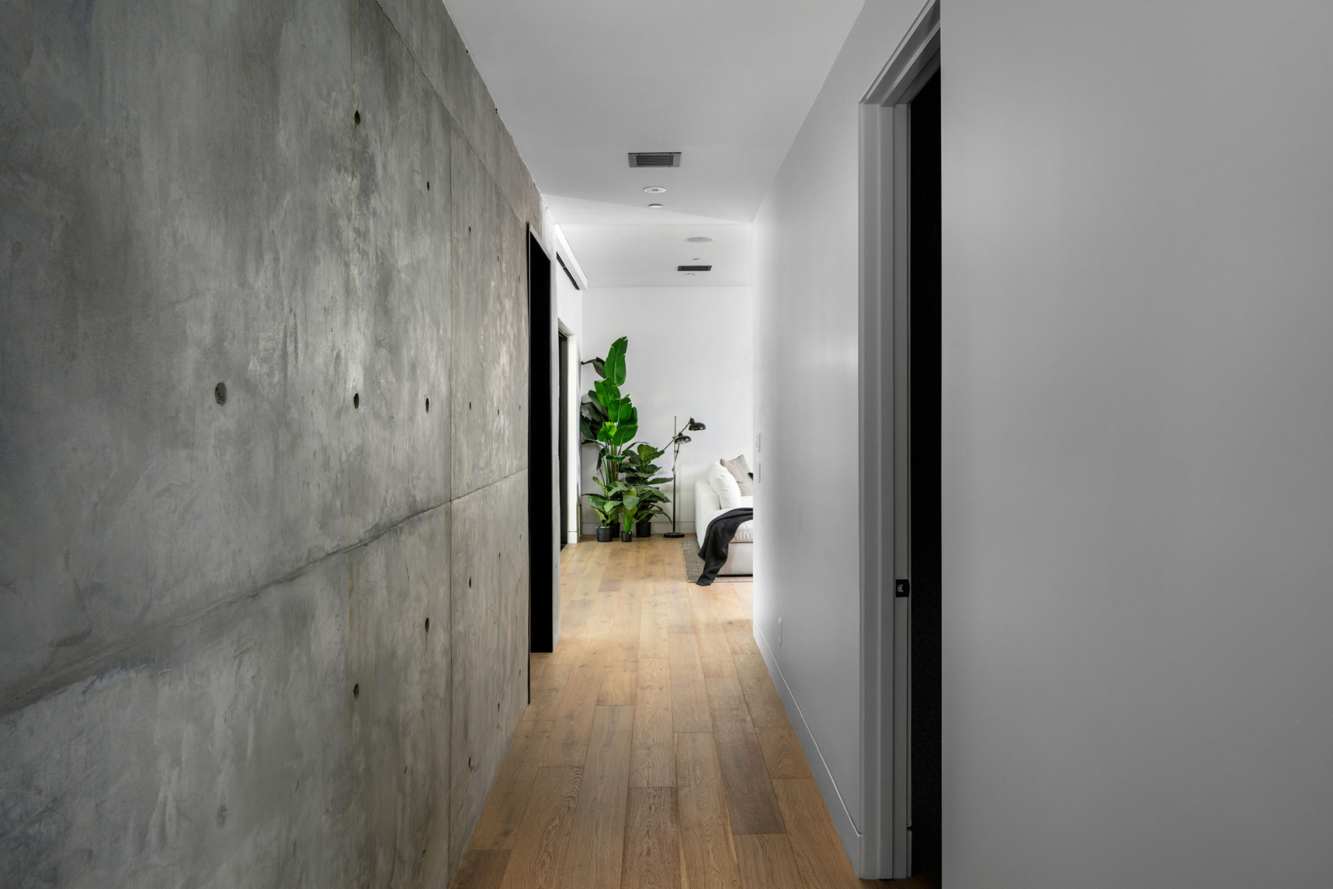 Hallway with exposed concrete and oak flooring