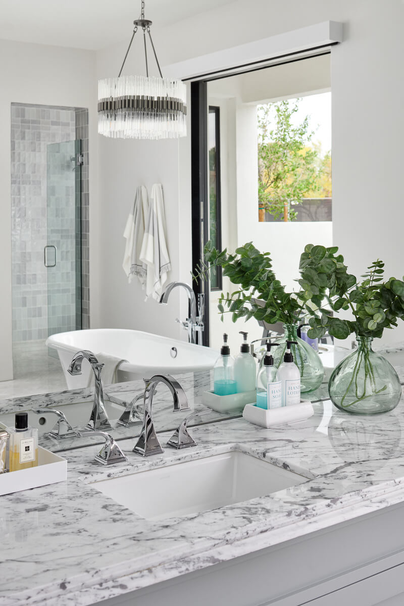 Marble vanity with garden views