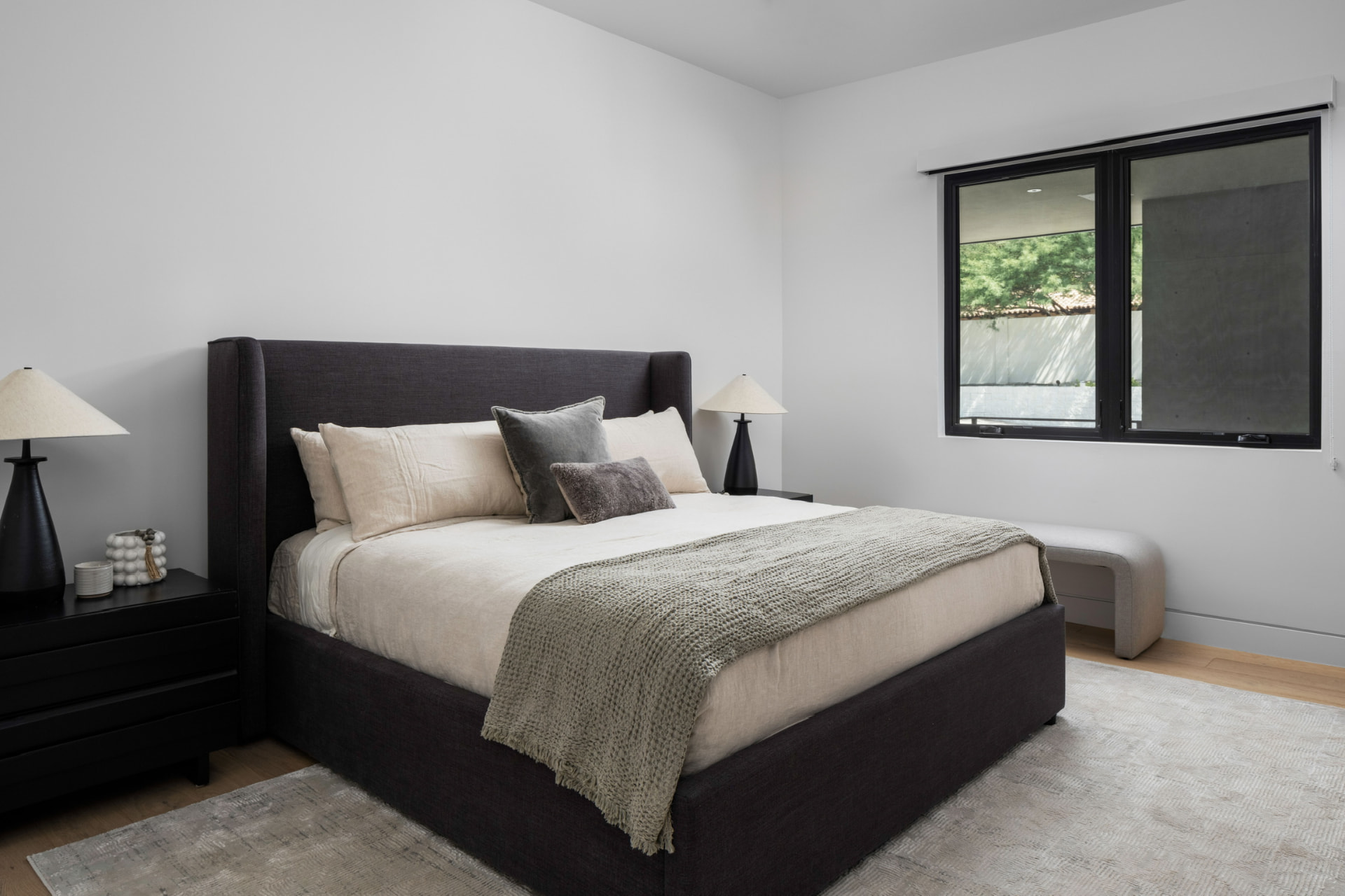 Guest bedroom with charcoal upholstered bed