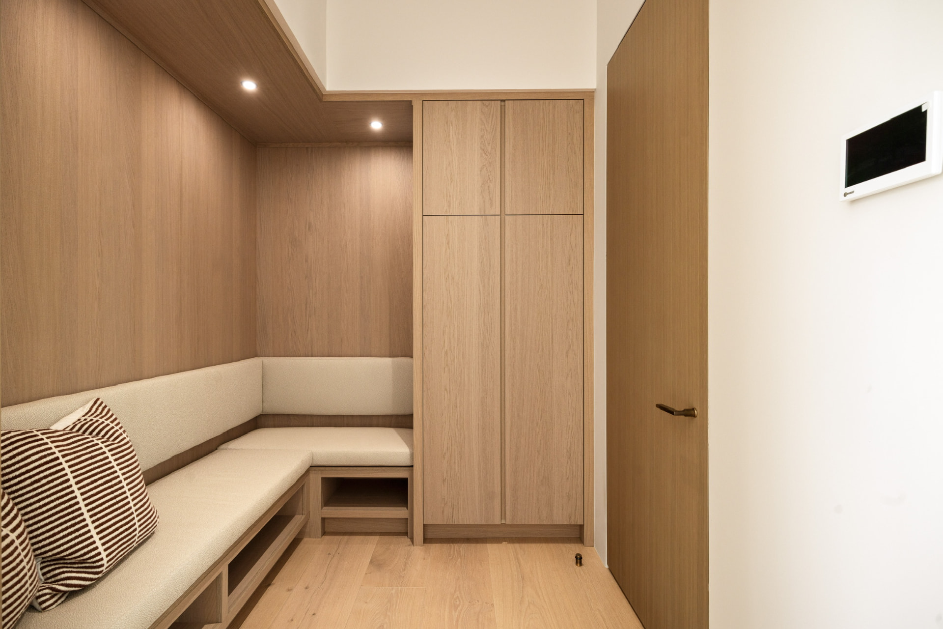 Mudroom with white oak bench and cabinetry