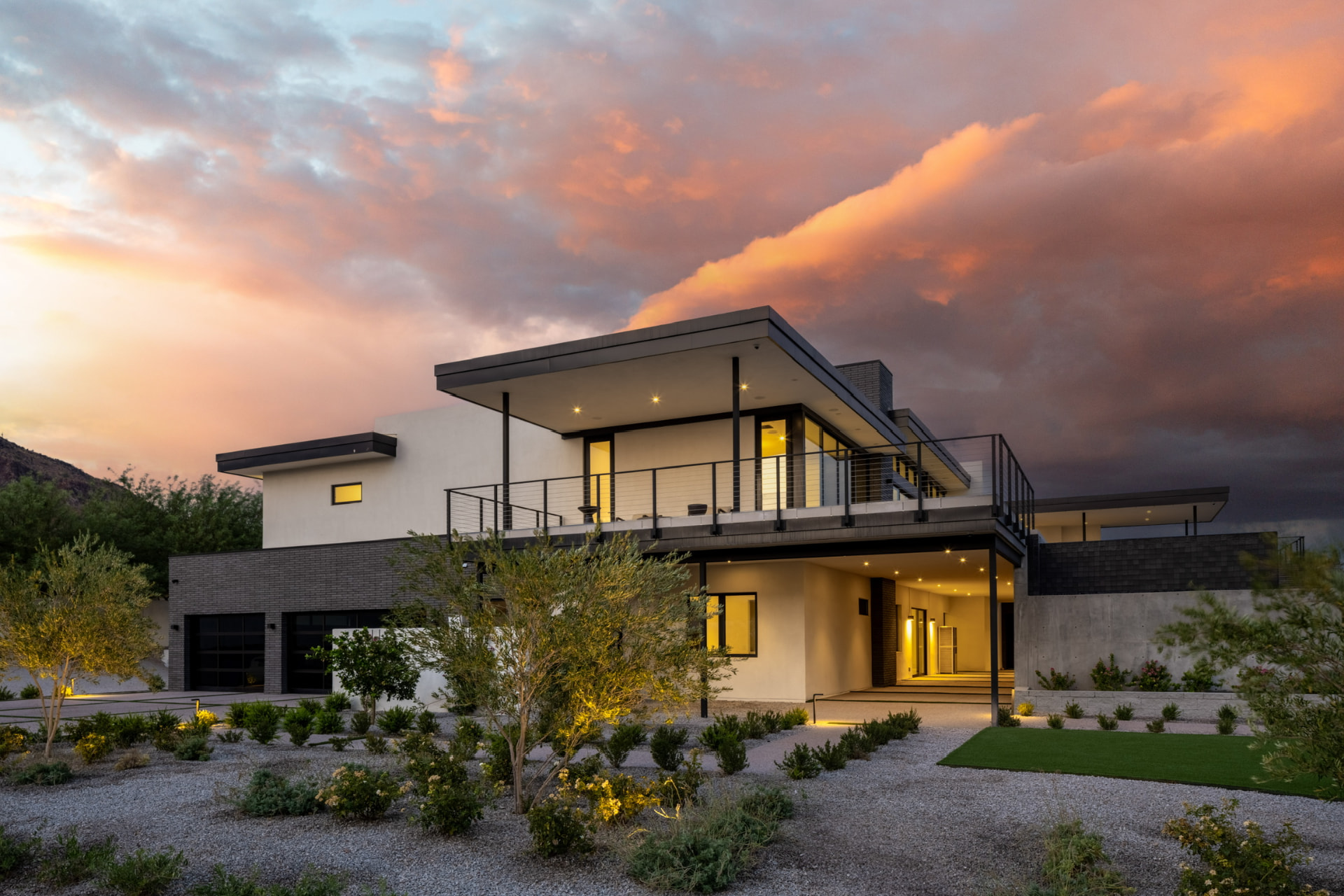 Front entrance and garage at sunset