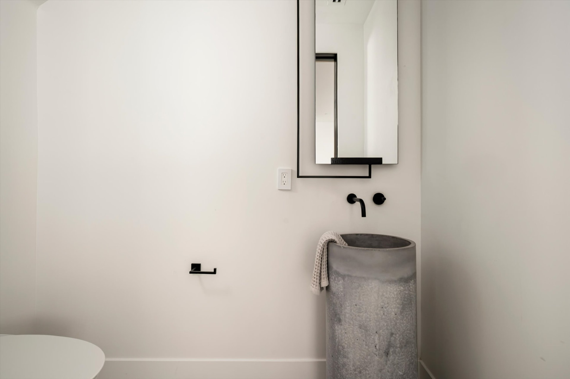 Powder room concrete pedestal sink