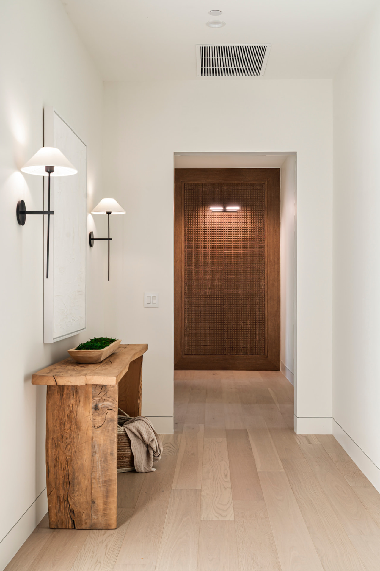Hallway with wood door