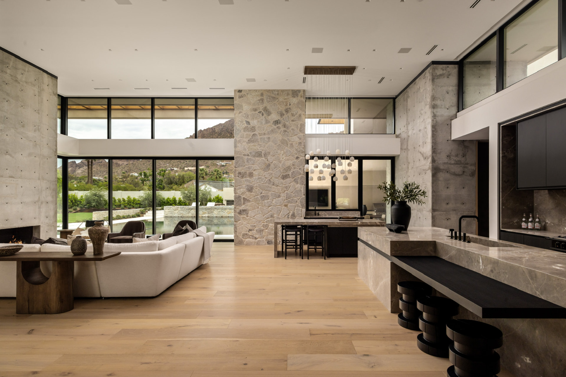 Double-height great room with stone and concrete