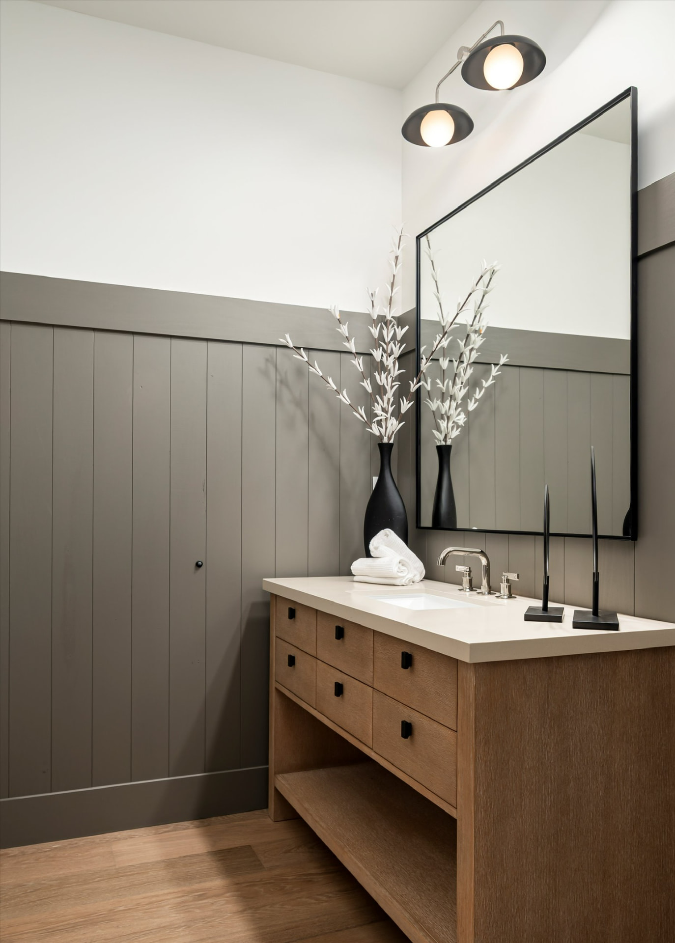 Powder room with gray panel walls