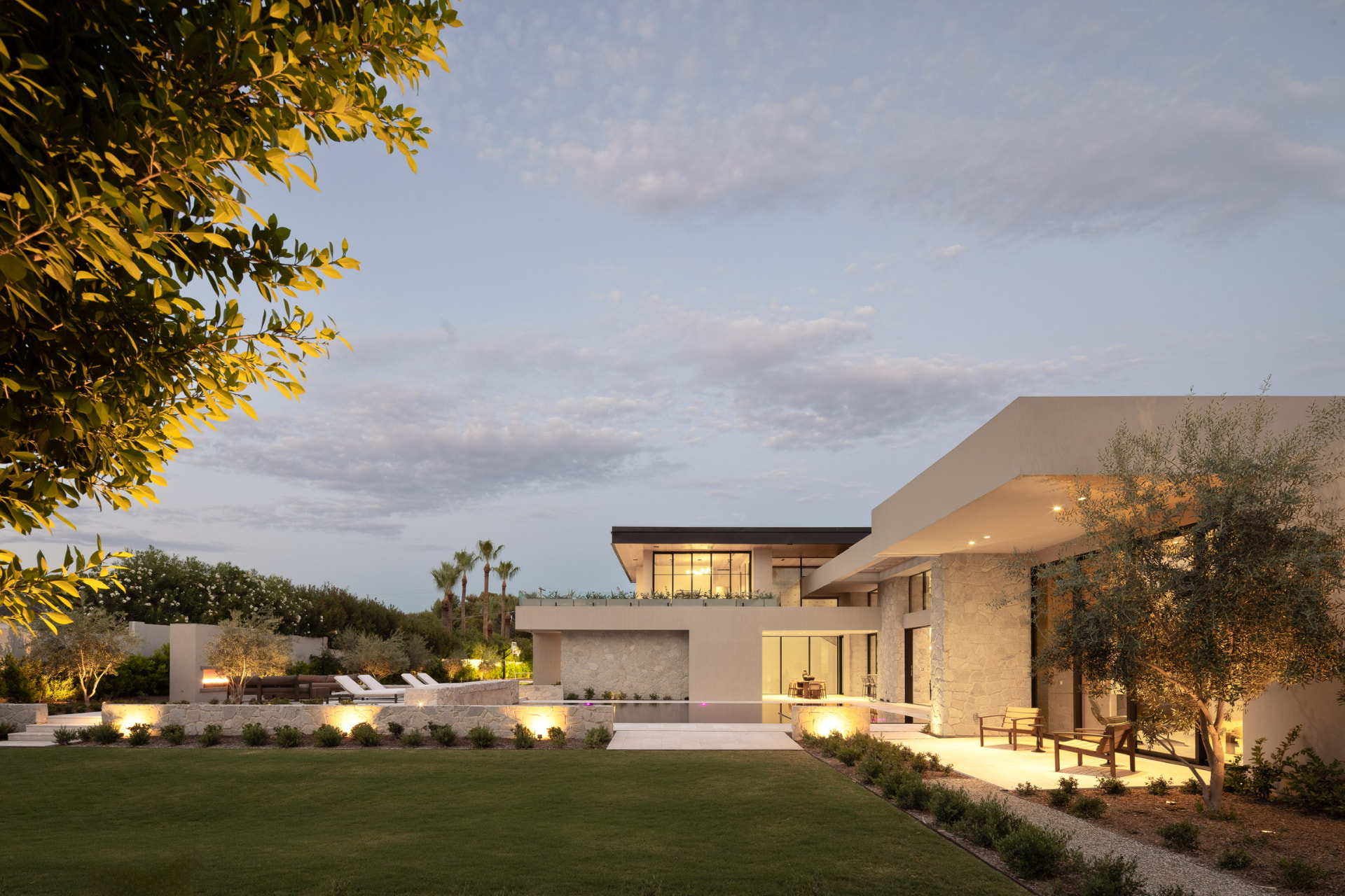 Rear grounds and pool terraces at dusk