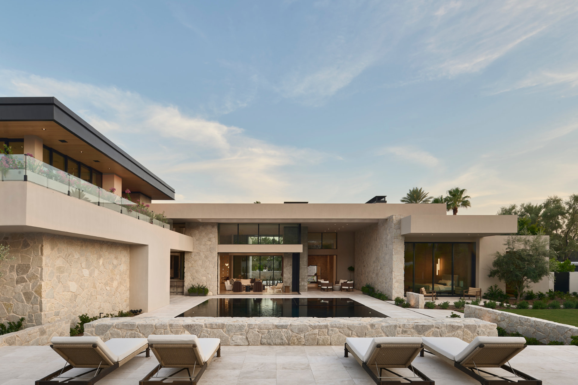Daytime pool terrace with sun loungers