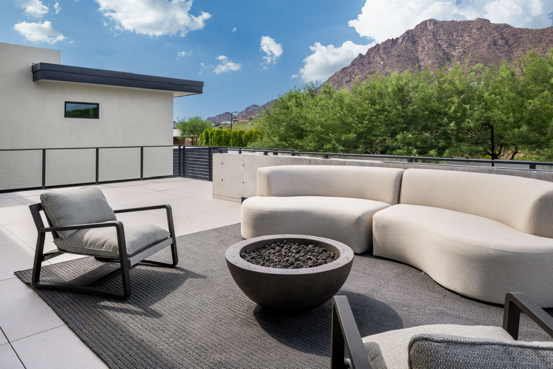Mountain-view terrace with outdoor seating and fire bowl