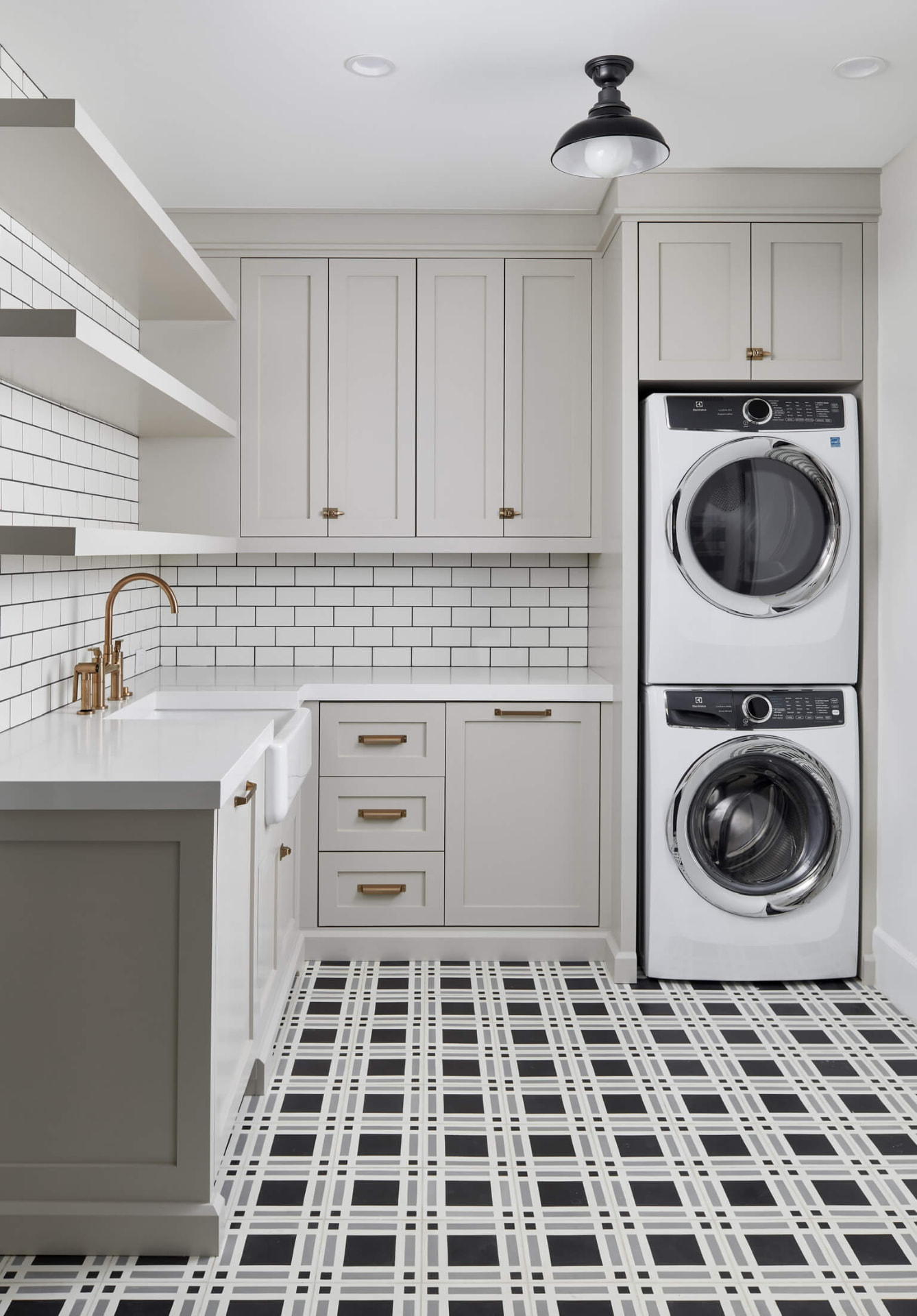 Laundry room with plaid tile floor