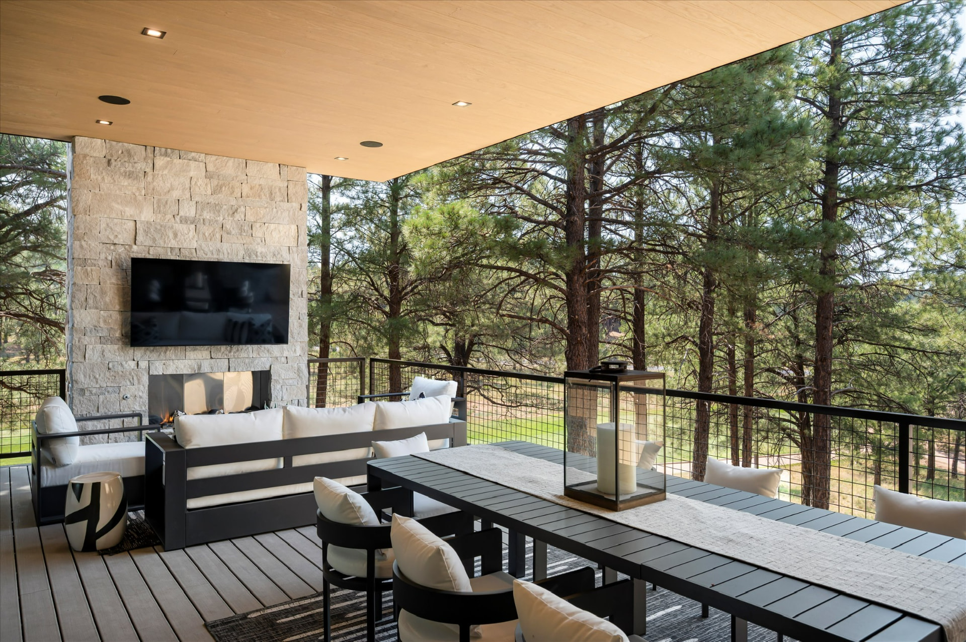 Covered terrace with stone fireplace