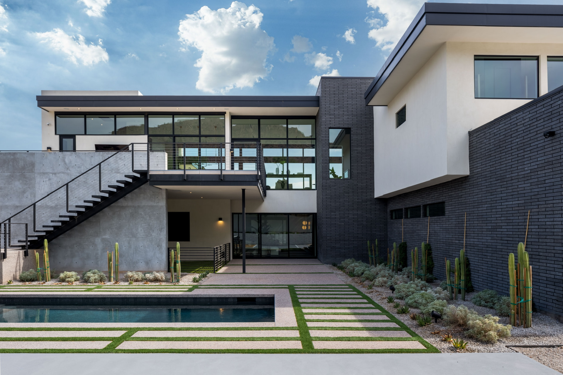 Courtyard pool and black brick exterior