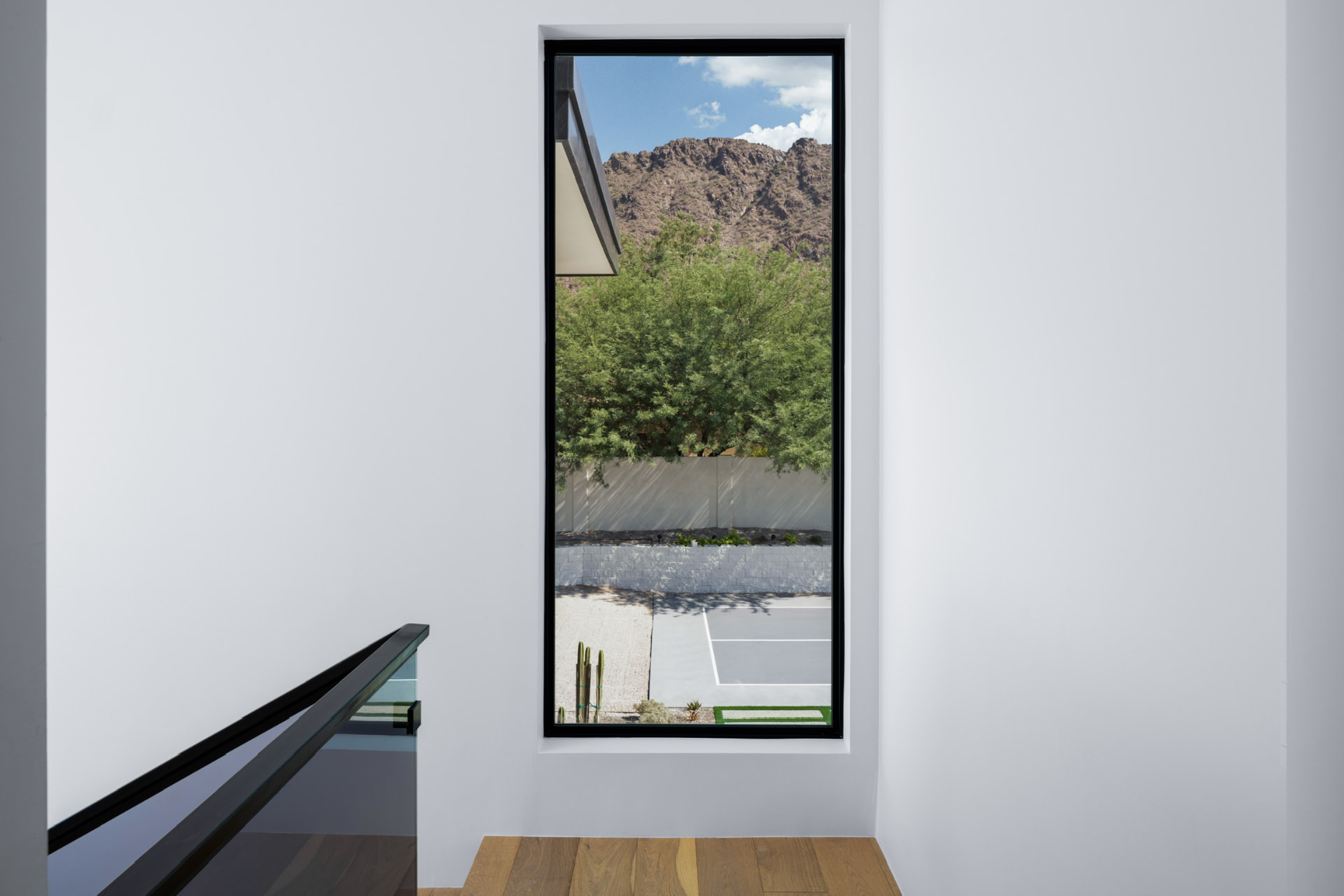 Mountain view through the stair landing window